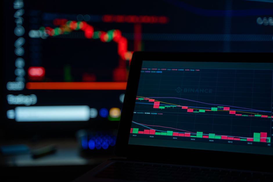 Dimly lit desk setup with crypto trading and darknet security telemetry