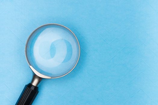 A magnifying glass symbolizing searching Tor hidden services with Ahmia